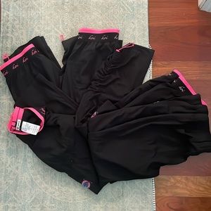 4 pairs of koi lite scrub bottoms black. Slim fit and one jogger style.small